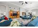 Bright living room with tile floors, recessed lighting, ceiling fan and built in entertainment center at 13711 Moonstone Canyon Dr, Riverview, FL 33579