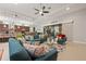 Bright living room with tile floors, recessed lighting, sliding glass doors, and a modern design at 13711 Moonstone Canyon Dr, Riverview, FL 33579