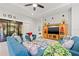 Comfortable living room featuring tile floors, ceiling fan, slider doors, and recessed lighting at 13711 Moonstone Canyon Dr, Riverview, FL 33579