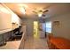 Compact kitchen featuring white cabinetry and modern appliances at 1372 Palmetto St, Clearwater, FL 33755