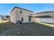 Backyard view of the two-story home, showcasing a spacious, fenced-in yard at 14269 Lemon Yellow Tree Ln, Brooksville, FL 34613