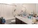 Functional bathroom with a single sink vanity, plentiful counter space and a shower-tub combo at 14269 Lemon Yellow Tree Ln, Brooksville, FL 34613