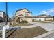 Charming two-story home with a well-manicured lawn, a two-car garage, and a mailbox with the house number at 14269 Lemon Yellow Tree Ln, Brooksville, FL 34613