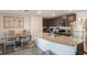 An eat-in kitchen featuring granite countertops, stainless steel appliances and gray wood-look floors at 14269 Lemon Yellow Tree Ln, Brooksville, FL 34613
