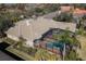 Aerial view of a well-maintained home with a tile roof and a screened-in pool at 16331 Burniston Dr, Tampa, FL 33647