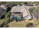 An aerial view of a private home with a backyard oasis and mature landscaping at 16331 Burniston Dr, Tampa, FL 33647