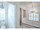 Bright bathroom with tiled floors, toilet, shower, and jacuzzi-style tub under a window at 16331 Burniston Dr, Tampa, FL 33647