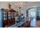 Elegant dining room featuring wood furniture and a chandelier at 16331 Burniston Dr, Tampa, FL 33647