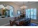 Elegant dining room featuring wood furniture and a chandelier at 16331 Burniston Dr, Tampa, FL 33647