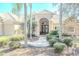 Elegant home exterior showcasing a tile roof, landscaped yard and double doors at 16331 Burniston Dr, Tampa, FL 33647