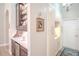 A butler's pantry with custom cabinetry, shelving and a wine cooler for additional storage at 16331 Burniston Dr, Tampa, FL 33647