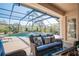 Comfortable and inviting lanai with ample seating and a pool view at 16331 Burniston Dr, Tampa, FL 33647