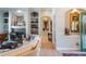 Elegant living room with built-in shelving and a fireplace, offering a comfortable and stylish gathering space at 16331 Burniston Dr, Tampa, FL 33647