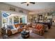 Comfortable living room with a large sectional sofa that looks onto the kitchen and backyard at 16331 Burniston Dr, Tampa, FL 33647