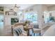 Bright living room with an open floor plan featuring views of the pool and backyard at 16331 Burniston Dr, Tampa, FL 33647