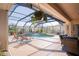 Covered pool area featuring comfortable seating, chairs for lounging, and screened in for outdoor entertainment at 16331 Burniston Dr, Tampa, FL 33647