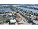 Aerial view of a waterfront neighborhood showcasing numerous homes with boat docks and access to the waterway at 17401 1St E St, Redington Shores, FL 33708