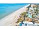 Picturesque beachfront homes along the coast with palm trees and beautiful beach access at 19417 Gulf Blvd # D-206, Indian Shores, FL 33785