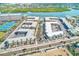 An aerial perspective of the Barefoot Beach Resort complex, highlighting the lush surroundings and convenient location at 19417 Gulf Blvd # D-206, Indian Shores, FL 33785
