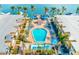Aerial view of the pool with boat docks and parking in the Barefoot Beach Resort community at 19417 Gulf Blvd # D-206, Indian Shores, FL 33785