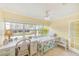 Bright bedroom features a cozy bed, ample natural light, and a relaxing workspace with a desk at 19417 Gulf Blvd # D-206, Indian Shores, FL 33785