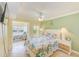 Inviting bedroom featuring a comfortable bed, a serene sitting area, and a bright, airy atmosphere at 19417 Gulf Blvd # D-206, Indian Shores, FL 33785