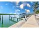 A view of boat dock showing direct access to the water, with lush surroundings and a scenic atmosphere at 19417 Gulf Blvd # D-206, Indian Shores, FL 33785