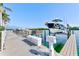 The boat dock in the resort, providing convenient access to waterfront activities with clear skies above at 19417 Gulf Blvd # D-206, Indian Shores, FL 33785