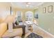 Comfortable living room featuring a plush sofa, coastal accents, and a bright, airy atmosphere at 19417 Gulf Blvd # D-206, Indian Shores, FL 33785