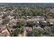 Wide aerial shot shows a neighborhood filled with homes and mature trees, providing a sense of community at 245 Faithway Dr, Seffner, FL 33584
