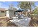 Backyard patio area features a table with umbrella perfect for outdoor entertaining and relaxation at 245 Faithway Dr, Seffner, FL 33584