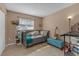 Comfortable bedroom with a neutral color scheme and a well-lit, inviting ambiance at 245 Faithway Dr, Seffner, FL 33584