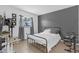 This cozy bedroom has tile floors, a window, and a metal bed frame at 245 Faithway Dr, Seffner, FL 33584