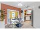Dining area with modern table set and sliding glass doors to the patio at 245 Faithway Dr, Seffner, FL 33584