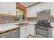 Well-maintained kitchen with stainless steel appliances and ample cabinet space at 245 Faithway Dr, Seffner, FL 33584