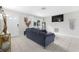 Cozy living room with front door, large window, and a comfortable-looking couch at 245 Faithway Dr, Seffner, FL 33584