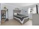 Neutral main bedroom featuring a large window for natural light and modern finishes at 245 Faithway Dr, Seffner, FL 33584