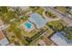 An aerial view showing the roof, backyard pool, and proximity to the adjacent street at 306 Indian Rocks S Rd, Largo, FL 33770