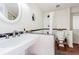 Bathroom featuring a pedestal sink, tub and shower, and a toilet at 306 Indian Rocks S Rd, Largo, FL 33770