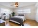 Bedroom features a ceiling fan, desk area, and natural light from a window at 306 Indian Rocks S Rd, Largo, FL 33770