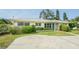 Charming single-story home with a well-manicured lawn and inviting curb appeal at 306 Indian Rocks S Rd, Largo, FL 33770