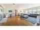 Spacious living room with hardwood floors, comfortable seating, and natural light at 306 Indian Rocks S Rd, Largo, FL 33770