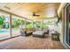 Inviting outdoor space with a covered seating area, a pool, and a backyard at 306 Indian Rocks S Rd, Largo, FL 33770
