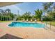 Inviting pool with lounge chairs surrounded by lush tropical landscaping, creating a private backyard oasis at 306 Indian Rocks S Rd, Largo, FL 33770