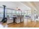 Bright dining room with a wood-burning stove, hardwood floors, and lots of natural light at 306 Indian Rocks S Rd, Largo, FL 33770