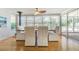 Sun-filled dining area with an accent wall and a view of the backyard at 306 Indian Rocks S Rd, Largo, FL 33770