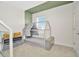 Bedroom with decorative bed, neutral color scheme, and a window with natural light at 31818 Treasure Dock Isle, Wesley Chapel, FL 33545