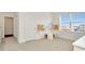 Bedroom with window features gray carpet, pegboard, and geometric decor accents at 31818 Treasure Dock Isle, Wesley Chapel, FL 33545