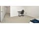 Neutral bedroom featuring a gaming desk and chair, and neutral carpet at 31818 Treasure Dock Isle, Wesley Chapel, FL 33545