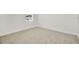 Minimalist bedroom with a single window, carpet, and white walls at 31818 Treasure Dock Isle, Wesley Chapel, FL 33545